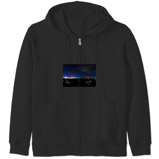 Long exposure photo of colorful city lights in the night and the sky Zip Hoodies